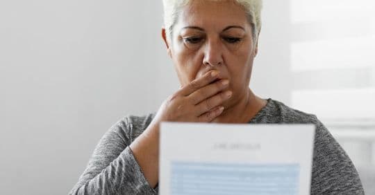 woman looking at water bill